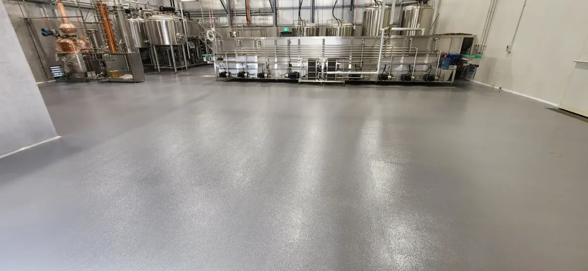 Concrete Masters v2 Epoxy floor coating in distribution center with safety line markings in Lawrenceville, Georgia